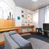 RedDoorz near Quirino Station Manila living room with sofa, TV, and bright windows in Manila