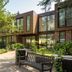 Princess Hotel de Wipselberg in Beekbergen exterior with modern glass facade and garden seating