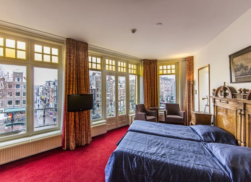 Amsterdam Wiechmann Hotel room with large windows and canal views in Amsterdam