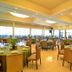 The Cocoon Boutique Hotel in Quezon City dining room with set tables and city views