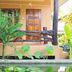 Lanta White Rock in Ko Lanta with a tropical porch, potted plants, and wooden railing