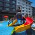 Raia Inn Penang in Bayan Lepas with outdoor pool and colorful water slide playground