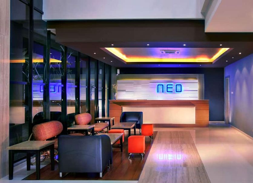 Hotel Neo Candi Semarang lobby lounge in Semarang with modern seating and reception desk
