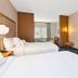 Fairfield by Marriott Inn & Suites Cincinnati Airport South/Florence guest room with two beds and wall-mounted TV in Florence
