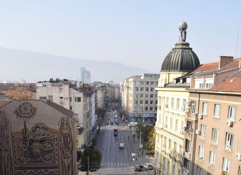 Slavyanska Beseda Hotel in Sofia with city street view and domed skyline