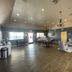 Kenedy Inn and Suites in Kenedy lobby with seating area, dining tables, and wood flooring