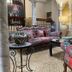 Alcoba del Rey de Sevilla lobby lounge with colorful sofas, table lamps and mural-style wall décor