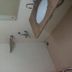 Hotel Rajmata Pvt Ltd bathroom with wall-mounted sink, mirror, and shower fixtures in Hyderabad