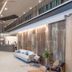 56 Hotel Bangkok lobby with high ceilings, modern seating, front desk and indoor waterfall wall