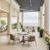 Azerai Ke Ga Bay in Phan Thiet: open-air seaside terrace with tables, chairs, and ocean view
