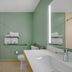 Best Western Wesley Chapel bathroom with walk-in shower, toilet, sink, and mint green walls