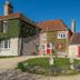 Manor Farm B&B in Marlborough, stone country house with red doors and ivy-covered facade