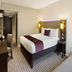 Premier Inn Norwich East - Broadlands/A47 guest room with double bed, desk, chair and wall-mounted TV in Norwich