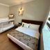 Nif Ankara Hotel in Ankara guest room with bunk beds, double bed and wooden flooring