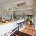 Nata Beach Villa in Ishigaki lobby bar with long counter, stools, and bright open seating area