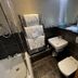 The Carrington Arms bathroom in Newport Pagnell with bathtub, toilet, sink and towel rack
