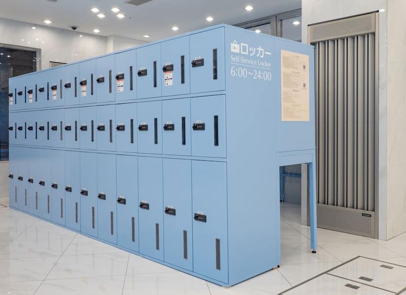 Toyoko Inn Tokyo Shinagawa Aomono-yokocho-eki lobby with blue luggage lockers in Tokyo