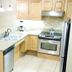 Wyndham Vacation Resorts Steamboat Springs kitchen with granite counters, stainless appliances, and bar seating