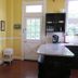 Yellow House B&B in Salado breakfast nook with coffee station, counter, and door to outside
