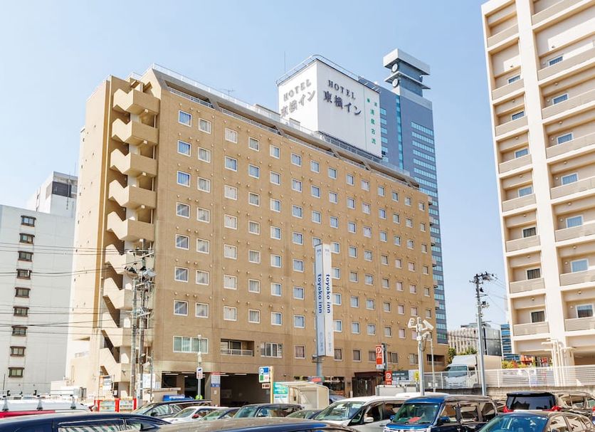 Toyoko Inn Sendai Nishi-Guchi Hirose-Dori exterior in Sendai with tall beige facade and city street view