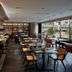 JW Marriott Hotel Hong Kong restaurant with buffet counter, dining tables, and large windows overlooking Hong Kong