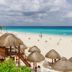 Condo in Ocean Front Resort in Cancún overlooking a white-sand beach and turquoise ocean