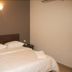 Jb City Hotel Johor Bahru guest room with double bed, bedside tables and wall light
