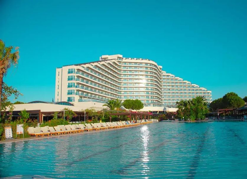Venosa Beach Resort And Spa in Didim with a large beachfront pool and sea-view hotel building