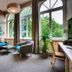 Upstalsboom Heringsdorf lounge with arched windows, seating area and garden view in Heringsdorf