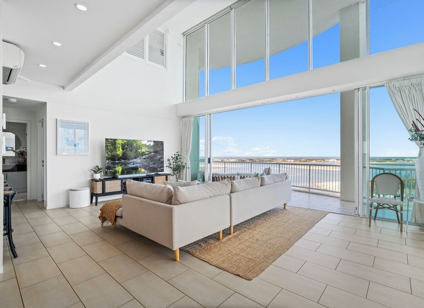 Crystal Bay On The Broadwater suite with floor-to-ceiling windows and balcony water views in Clear Island Waters
