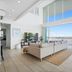 Crystal Bay On The Broadwater suite with floor-to-ceiling windows and balcony water views in Clear Island Waters