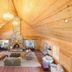 Franziska Haus Dundee luxury wood-paneled great room with vaulted ceiling and stone fireplace