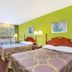 Super 8 by Wyndham Ashland/Richmond in Ashland: guest room with two double beds and green accent wall