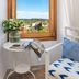 Finca Son Arnau in Selva room with window view over countryside, small table and chair