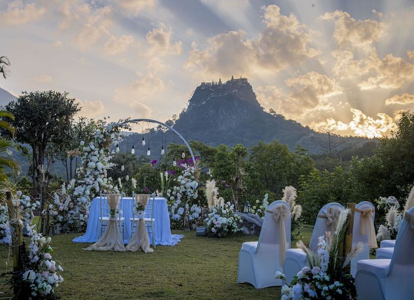 Popa Garden Resort in Popaywa, garden wedding setup with mountain view at sunset