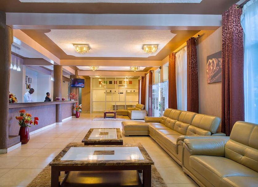 Kilimo Grand Resort Nairobi lobby with beige sofas, coffee tables, reception desk and tall windows