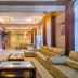 Kilimo Grand Resort Nairobi lobby with beige sofas, coffee tables, reception desk and tall windows