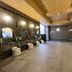 Hotel Route-Inn Kushiro Ekimae bathhouse with shower stations and tiled soaking area in Kushiro