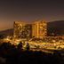 Harrah's Resort Southern California at dusk with illuminated towers and mountain views in Valley Center