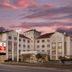 Best Western Plus Rose City Conference Center Inn in Thomasville exterior at dusk with pink sky