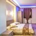 Mediterranean Holidays in Ierissós guest room with double bed, curtains, and balcony door