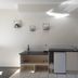 Metung Waters Motel and Apartments kitchen area with microwave, mini fridge, sink and shelving in Metung