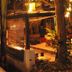 Lazy Dog Bed & Breakfast in Boracay, tropical outdoor dining area with warm lighting and bamboo walls