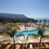 Blue Bay Resort Capo Vaticano pool terrace with palm trees and sea view