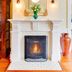 Fairholme Manor Inn Victoria fireplace with ornate gold mirror and vase on mantel