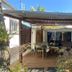 Chambres D'hotes Du Domaine Des Doudous in Saint-Pierre, covered wooden patio with dining area