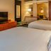 Fairfield Inn & Suites by Marriott Colorado Springs North/Air Force Academy room with two beds and TV