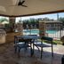 Candlewood Suites Baytown by IHG patio with grill, table and chairs overlooking the outdoor pool