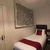 The Claremont, Woodhall Spa: single bed in a compact guest room with wall art and bedside lamp