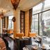 Chateau Star River Beijing restaurant with large windows, ornate columns and polished wood floors in Beijing